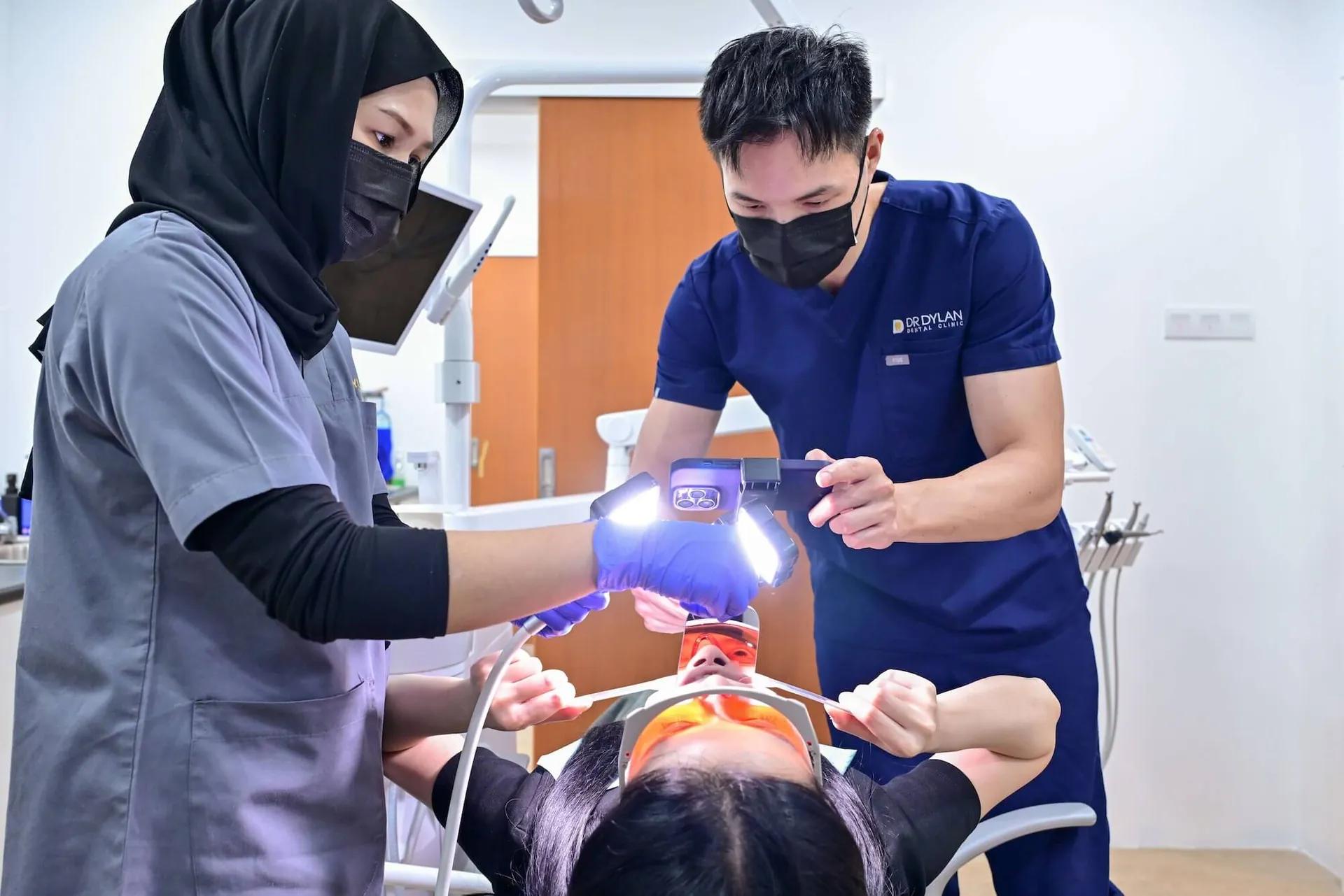 Dr. Dylan reviewing a digital dental scan with a patient